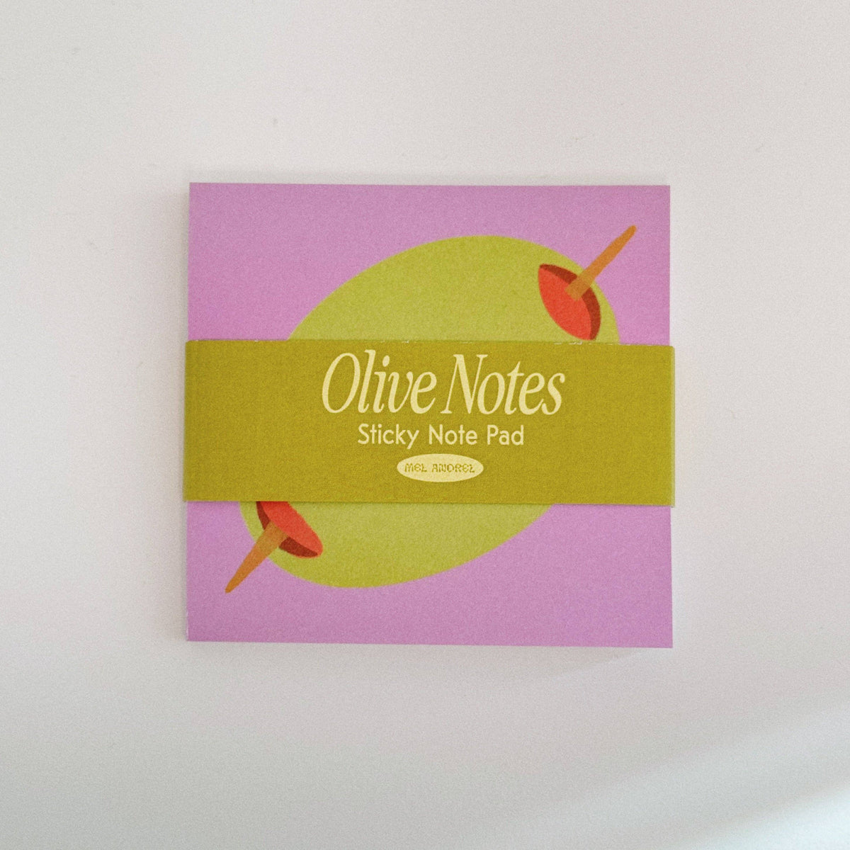 Olive Notes sticky note pad with pink background and green band